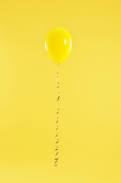 Bright balloon on color background. Celebration time