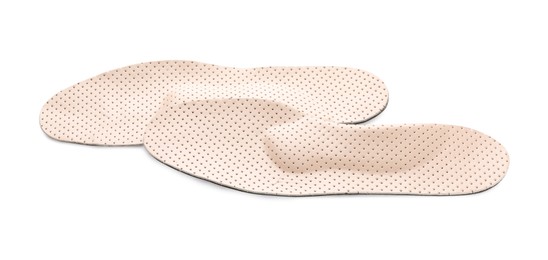 Beige comfortable orthopedic insoles isolated on white