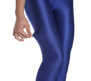 Photo of Woman with beautiful long legs wearing blue leggings on white background, closeup