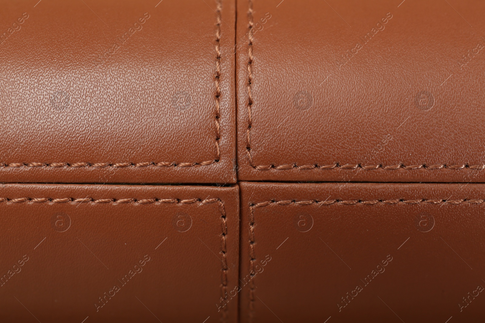 Photo of Texture of brown leather as background, top view