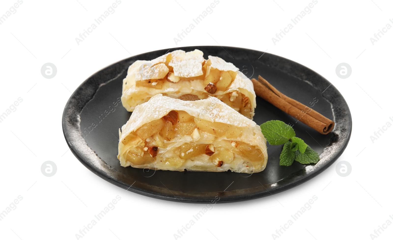 Photo of Pieces of delicious apple strudel with almonds, mint and cinnamon on white background