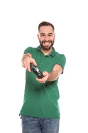 Emotional young man playing video games with controller isolated on white