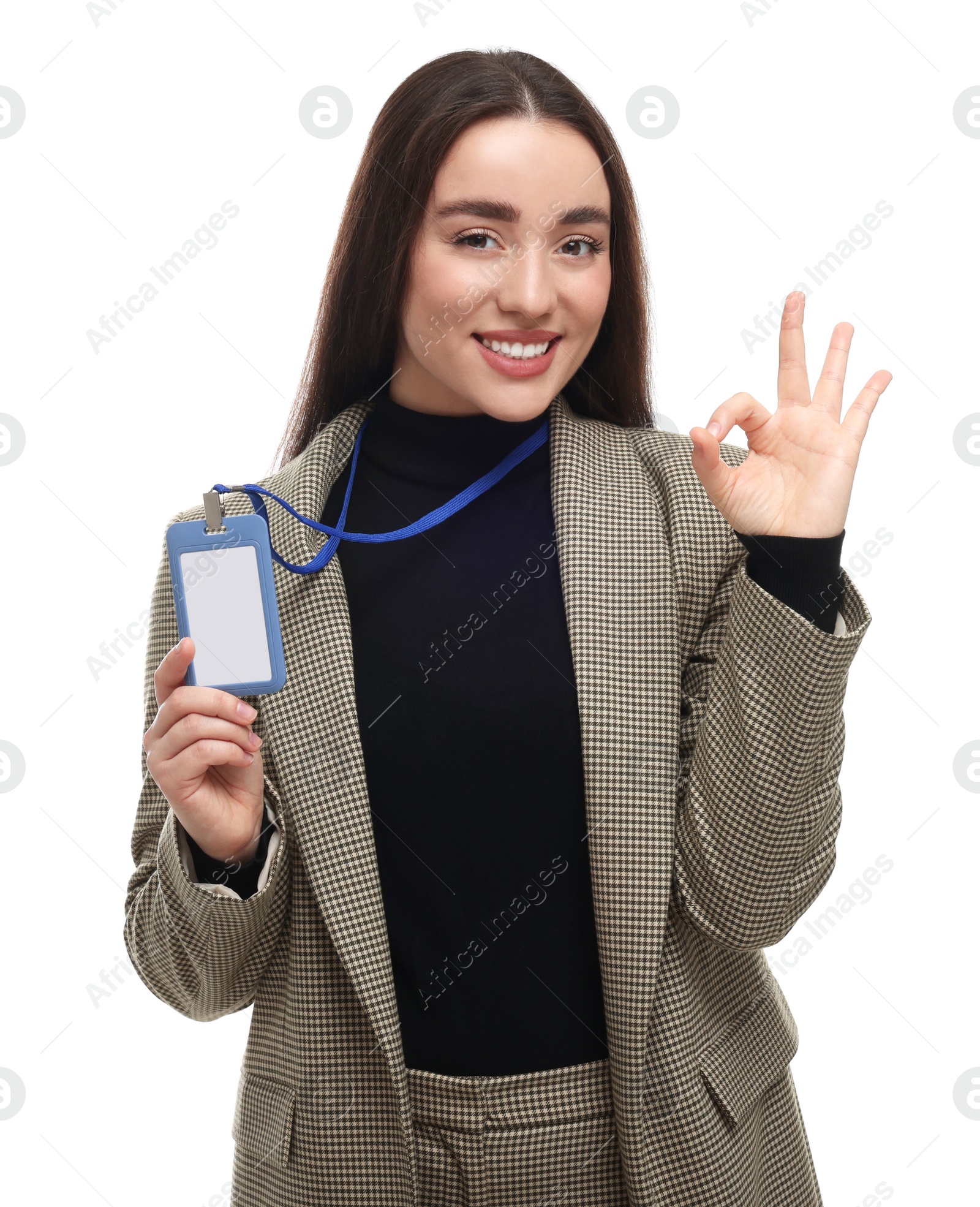 Photo of Happy woman with vip pass badge showing ok gesture on white background