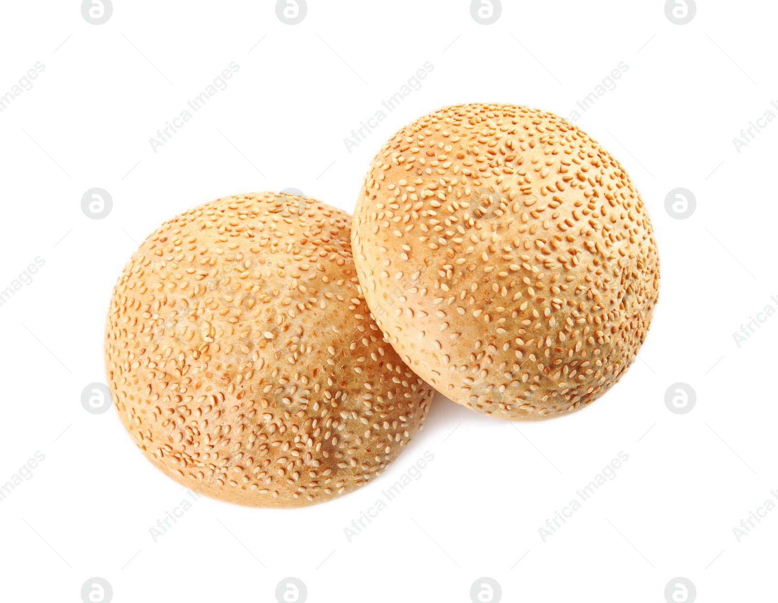 Photo of Buns with sesame seeds isolated on white, top view. Fresh bread