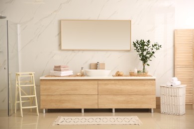 Modern bathroom interior with stylish mirror and vessel sink