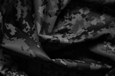 Image of Texture of crumpled camouflage fabric as background, closeup. Black and white effect