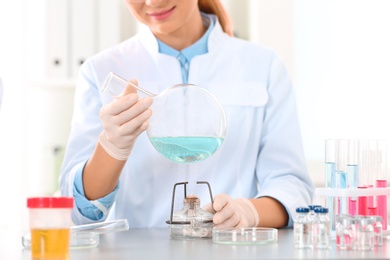 Photo of Scientist working in laboratory, closeup. Research and analysis