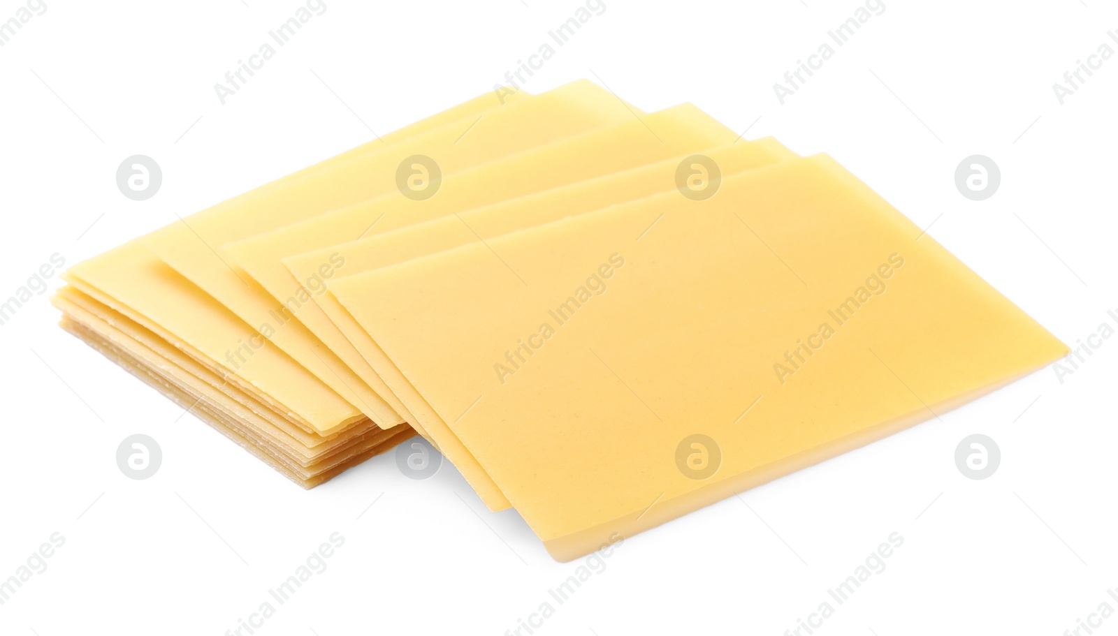 Photo of Stack of uncooked lasagna sheets isolated on white