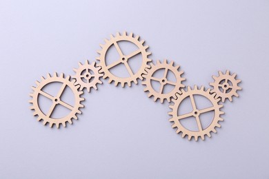 Photo of Business process organization and optimization. Scheme with wooden figures on light background, top view