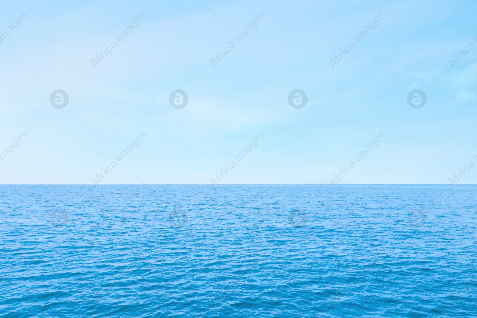 Image of Beautiful ripply sea under blue sky with clouds