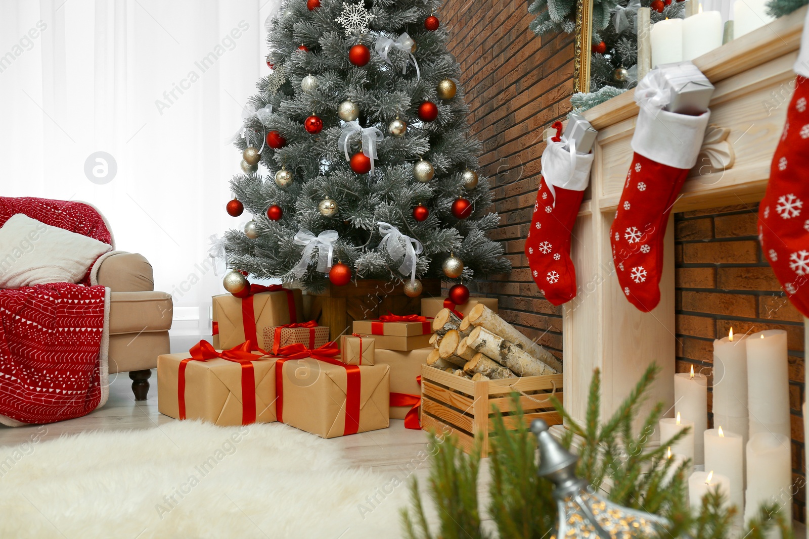 Photo of Stylish interior with beautiful Christmas tree and decorative fireplace