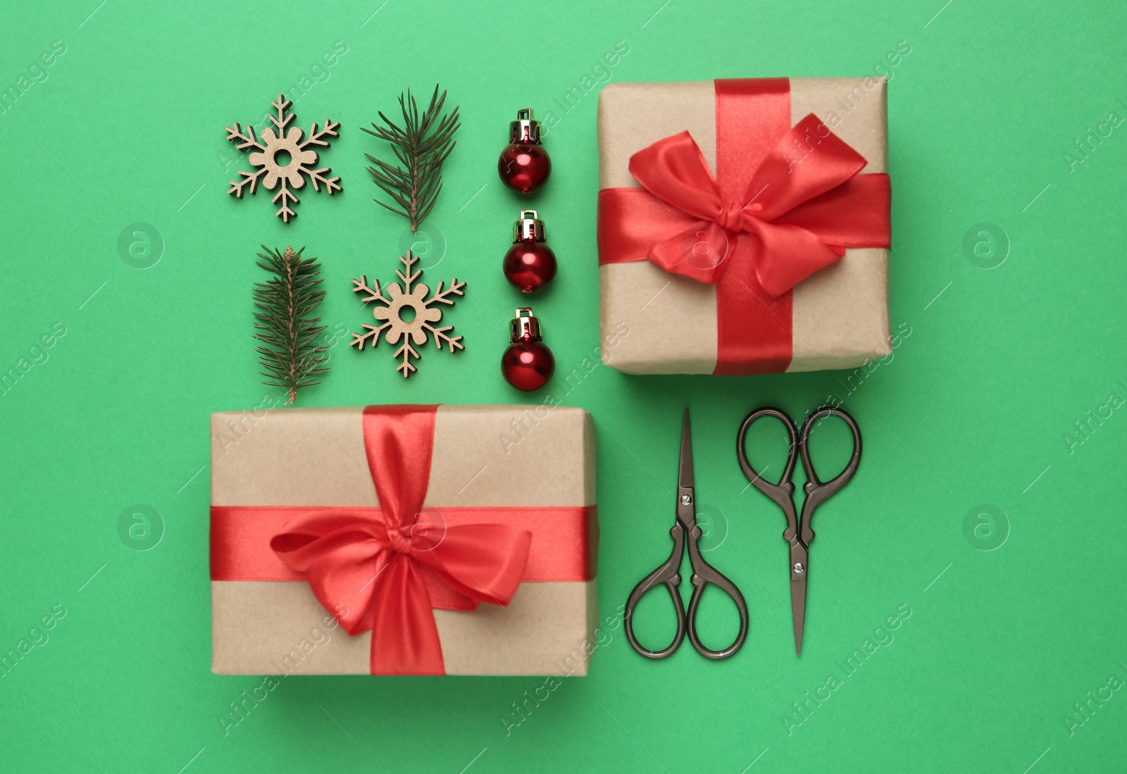 Photo of Flat lay composition with Christmas gifts on green background. Boxing day