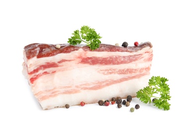 Photo of Piece of bacon with peppercorn and parsley isolated on white