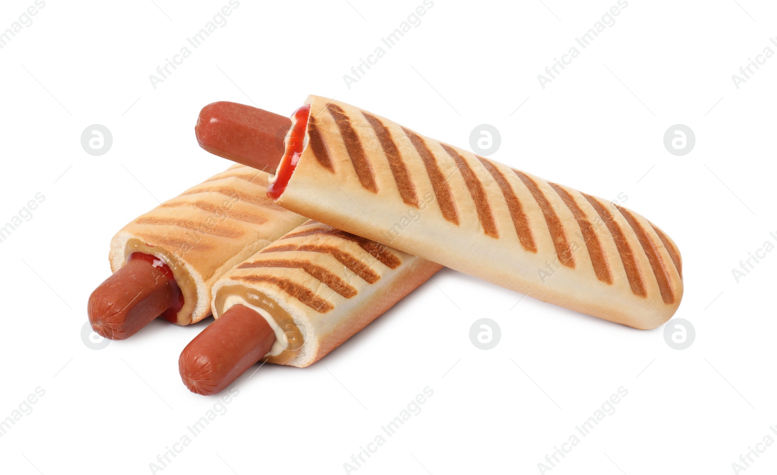 Photo of Tasty french hot dogs with different sauces on white background