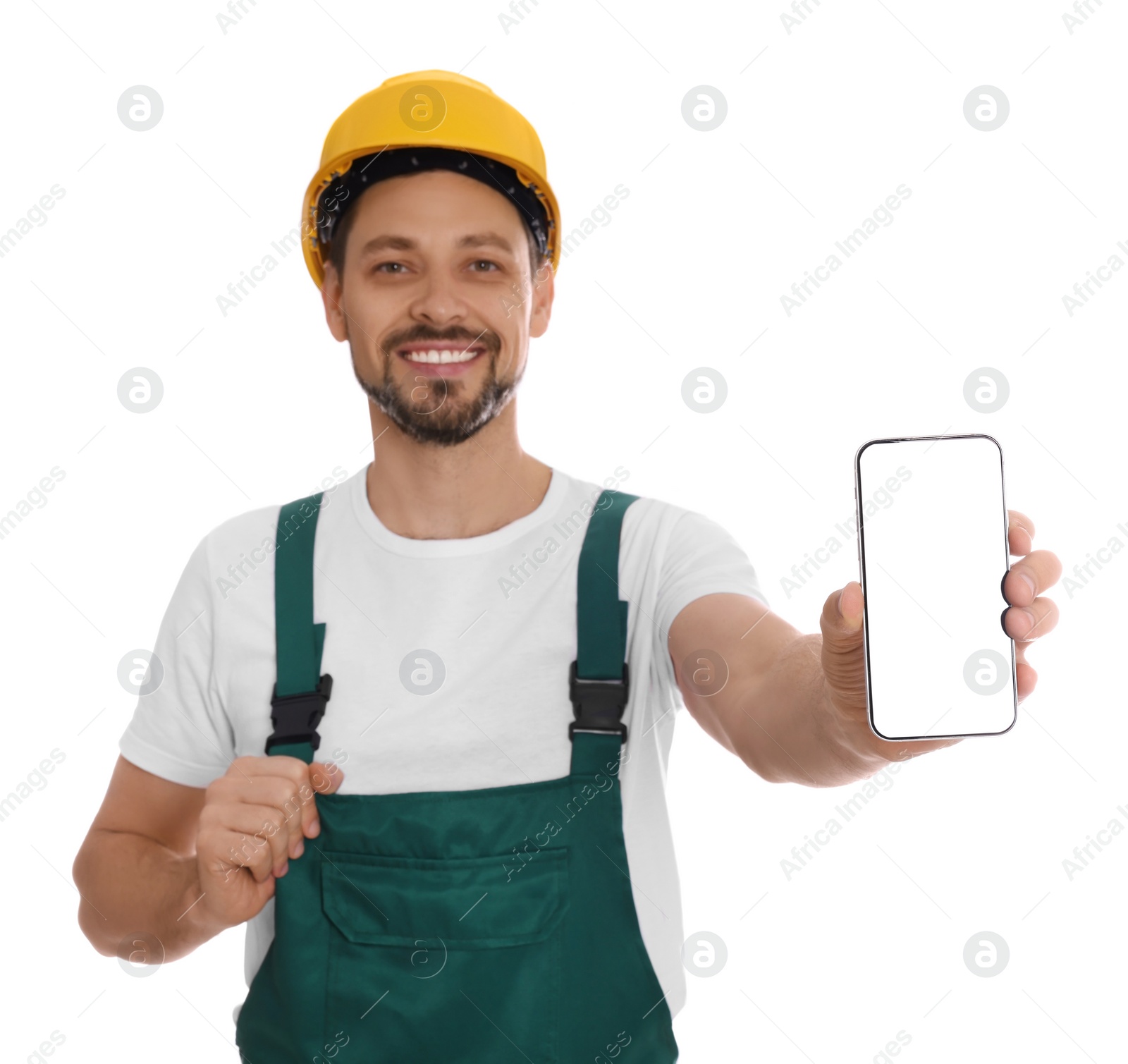 Photo of Professional repairman in uniform with phone on white background