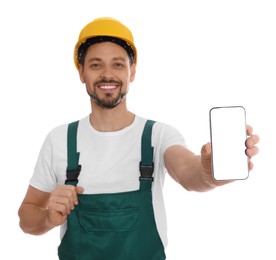 Photo of Professional repairman in uniform with phone on white background