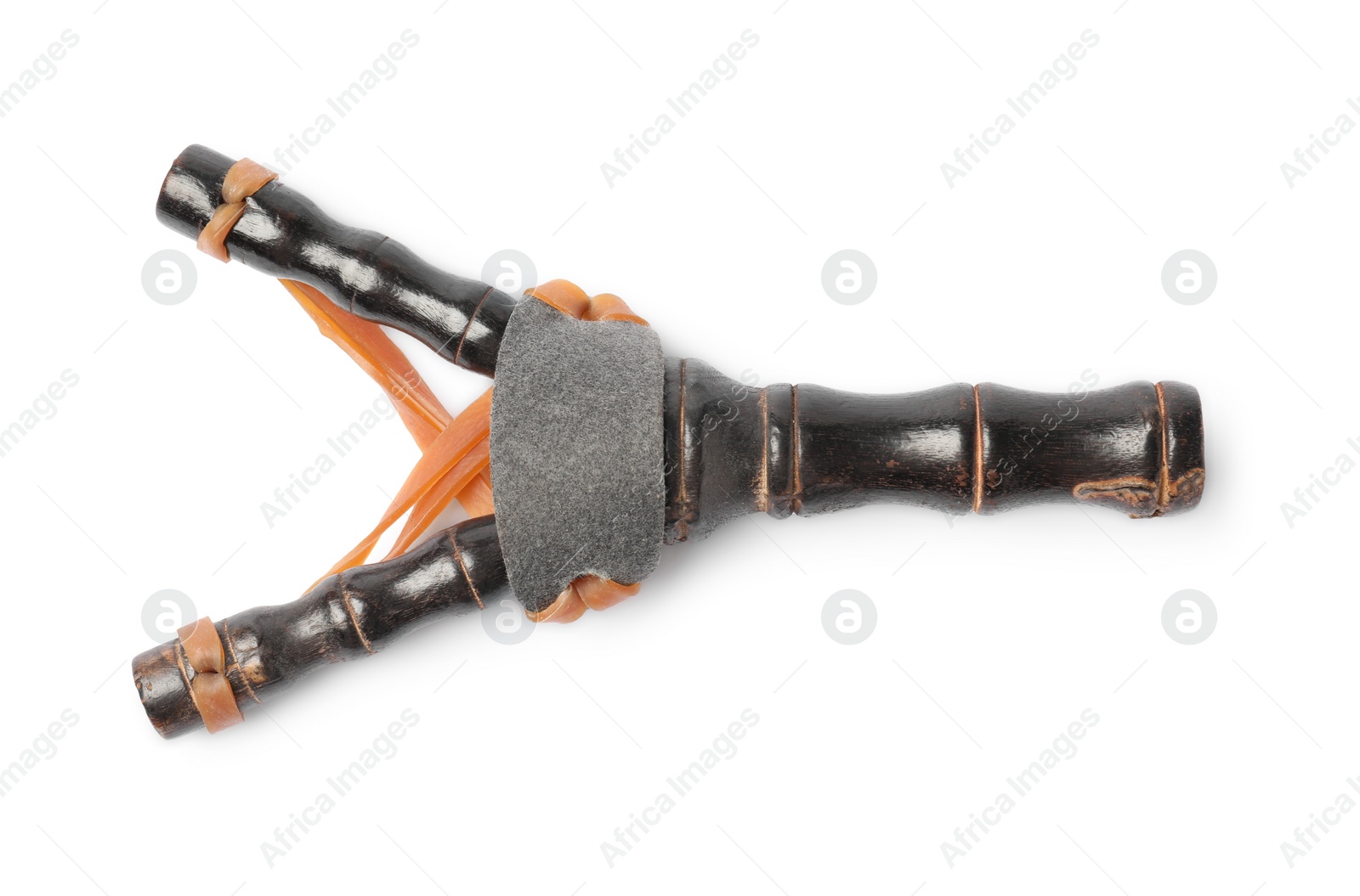 Photo of Black wooden slingshot with leather pouch on white background, top view