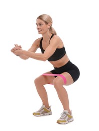 Photo of Woman exercising with elastic resistance band on white background