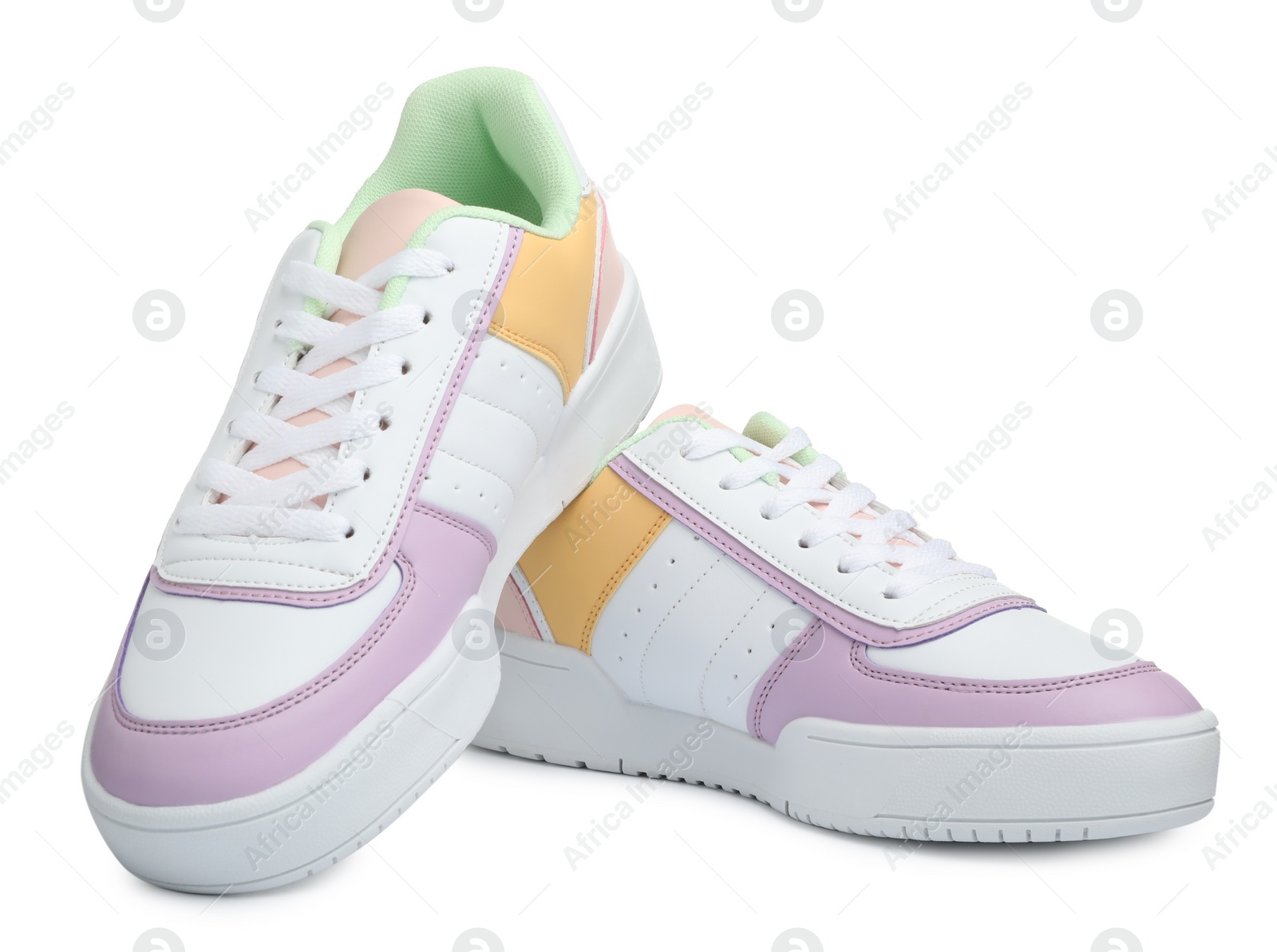 Photo of Pair of comfortable sports shoes on white background