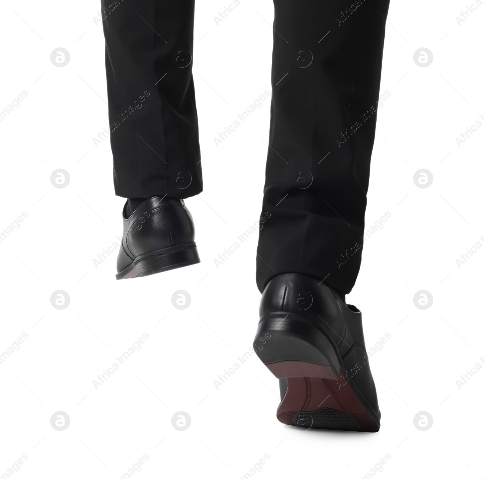 Photo of Businessman in leather shoes on white background, closeup