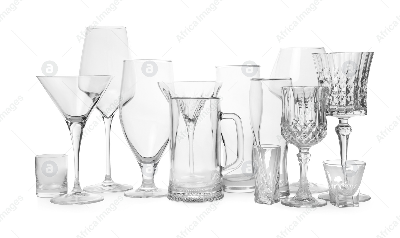 Photo of Different elegant empty glasses isolated on white