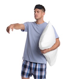 Photo of Somnambulist with blindfold and soft pillow on white background. Sleepwalking