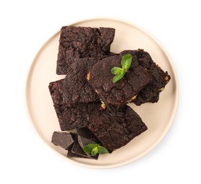 Photo of Delicious chocolate brownies with nuts and fresh mint on white background, top view