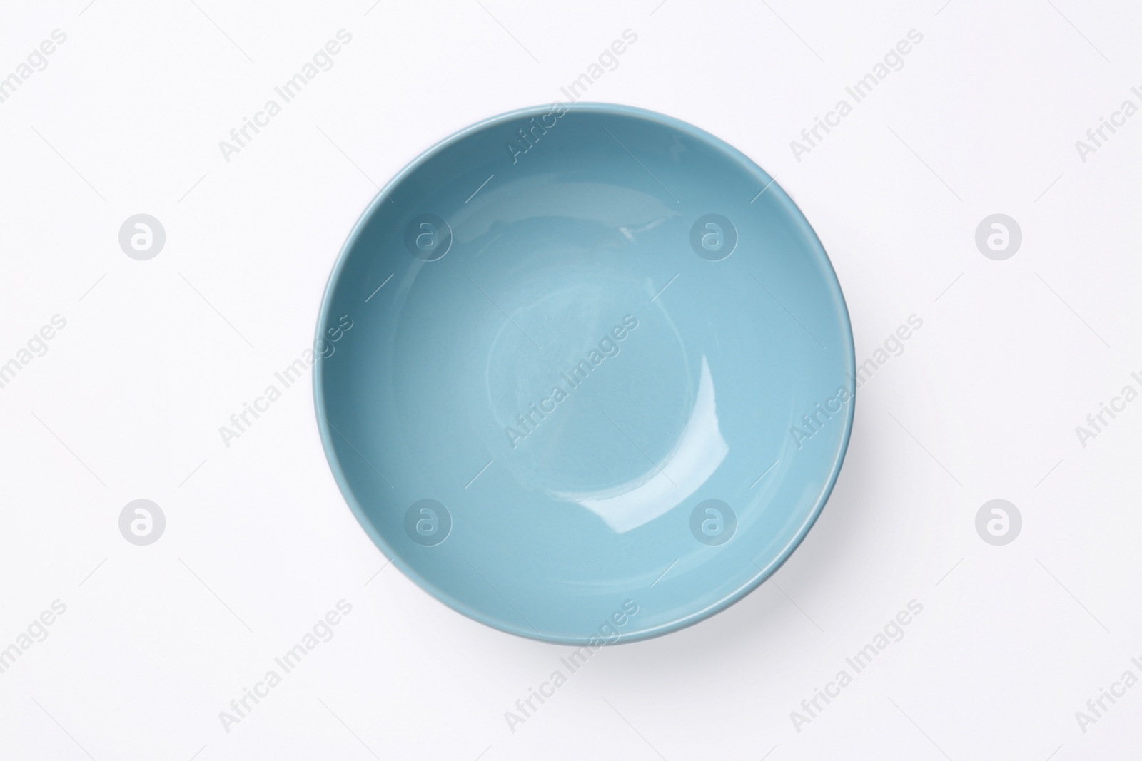 Photo of One clean plate on white background, top view. Ceramic dinnerware