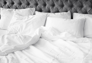 Photo of Comfortable bed with white linen at home