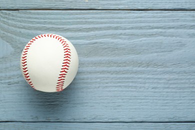 Photo of Baseball ball on grey wooden table, top view. Space for text