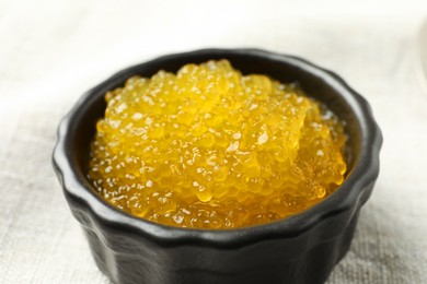 Fresh pike caviar in bowl on table, closeup