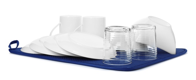 Photo of Clean tableware on towel against white background. Washing dishes