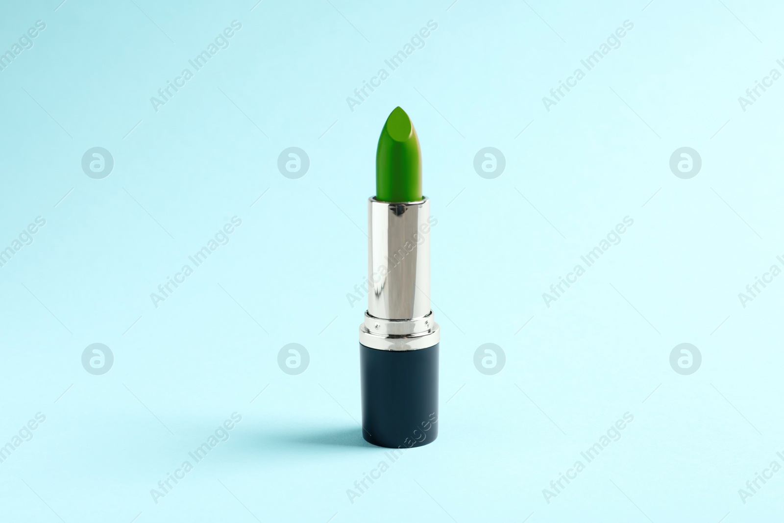 Image of Bright lipstick on light blue background  