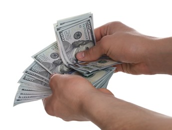 Money exchange. Man holding dollar banknotes on white background, closeup