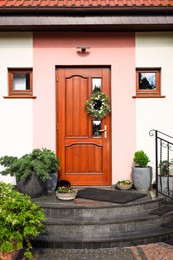 Photo of House with wooden door, view from outside. Exterior design