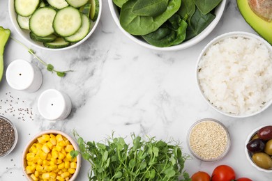 Ingredients for poke bowl on white marble table, flat lay. Space for text