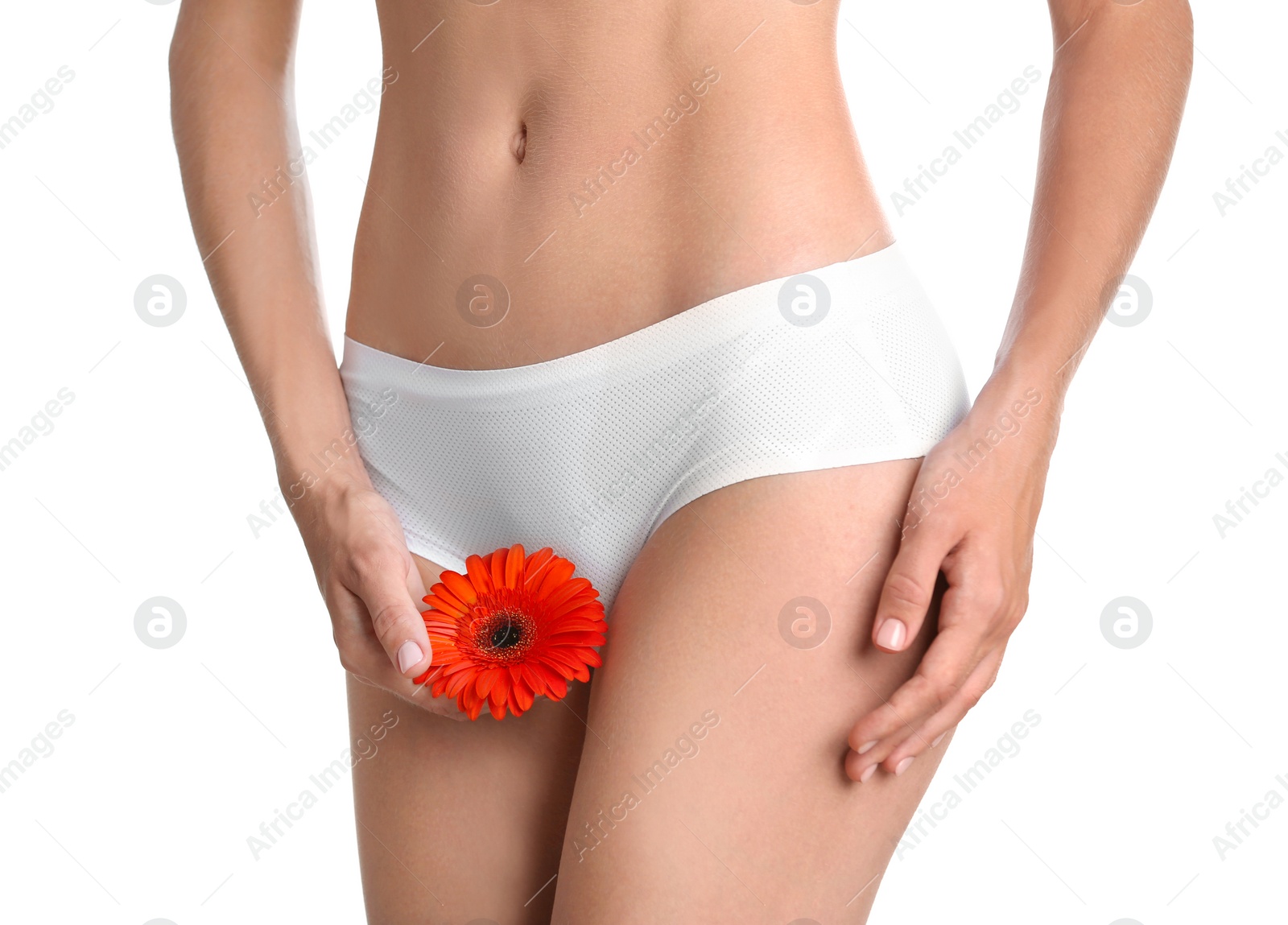 Photo of Young woman with gerbera flower on white background. Gynecology concept