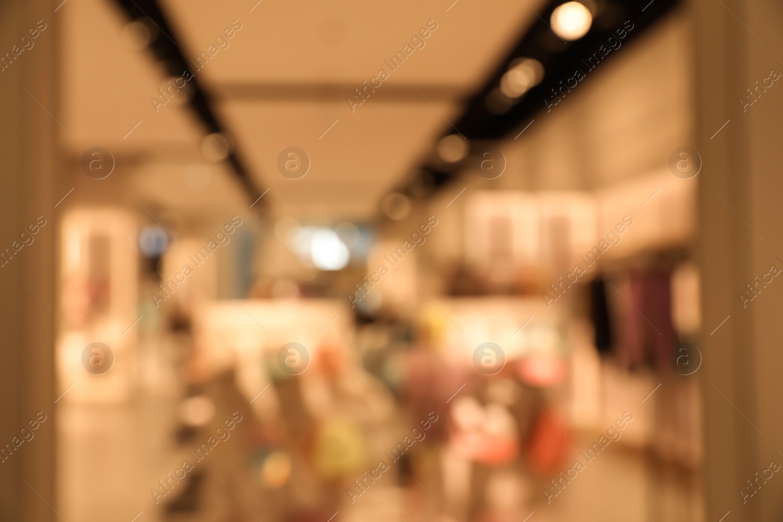 Photo of Blurred view of store interior in shopping mall. Bokeh effect