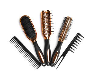Set of modern hair combs and brushes isolated on white, top view