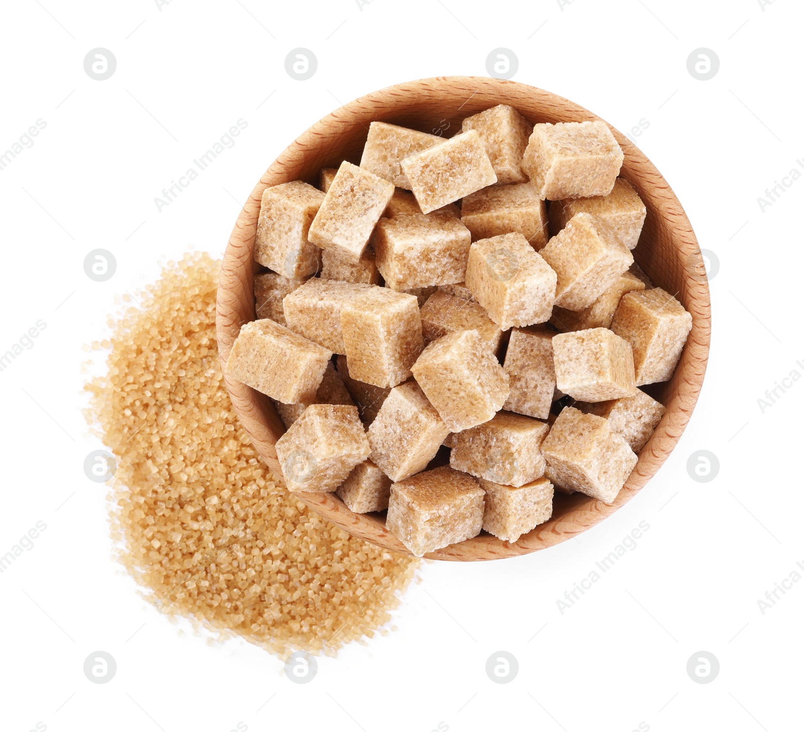 Photo of Different types of brown sugar and bowl isolated on white, top view