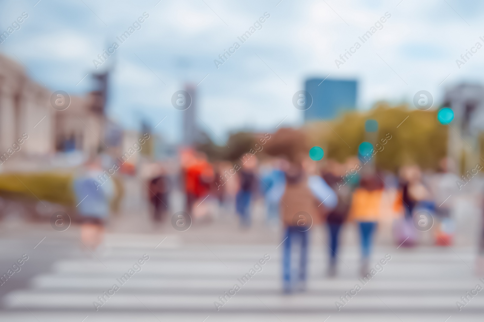 Photo of People crossing street in city, blurred view