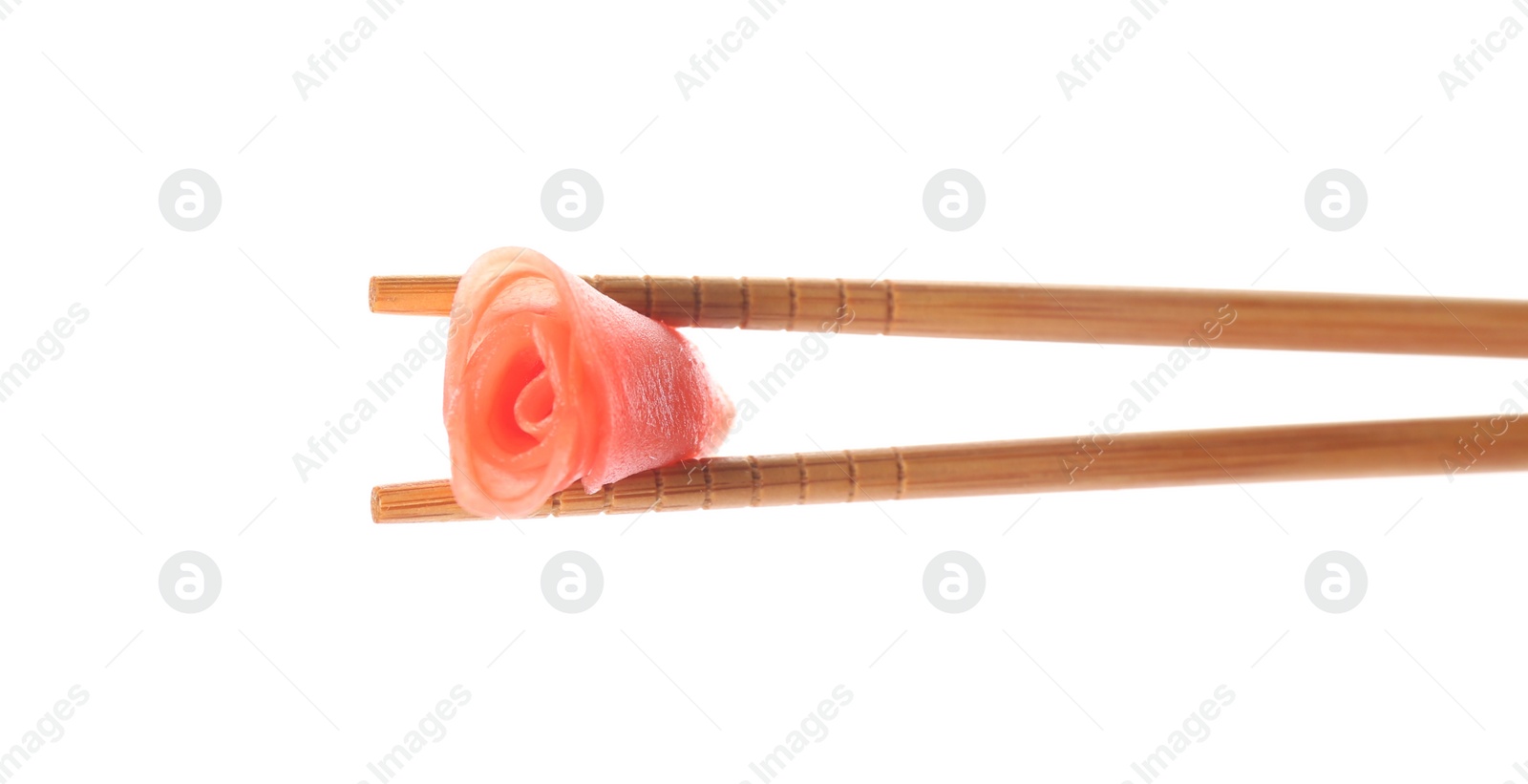 Photo of Chopsticks with pickled ginger on white background