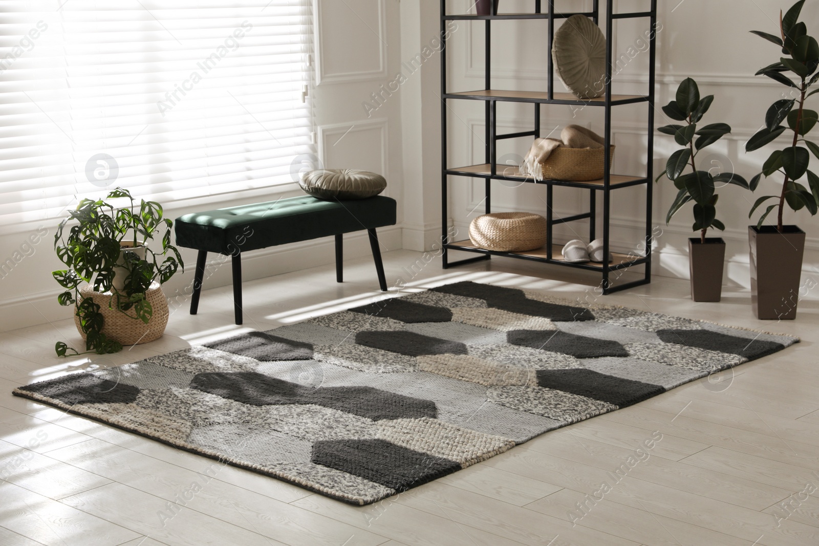 Photo of Stylish carpet with pattern on floor in room