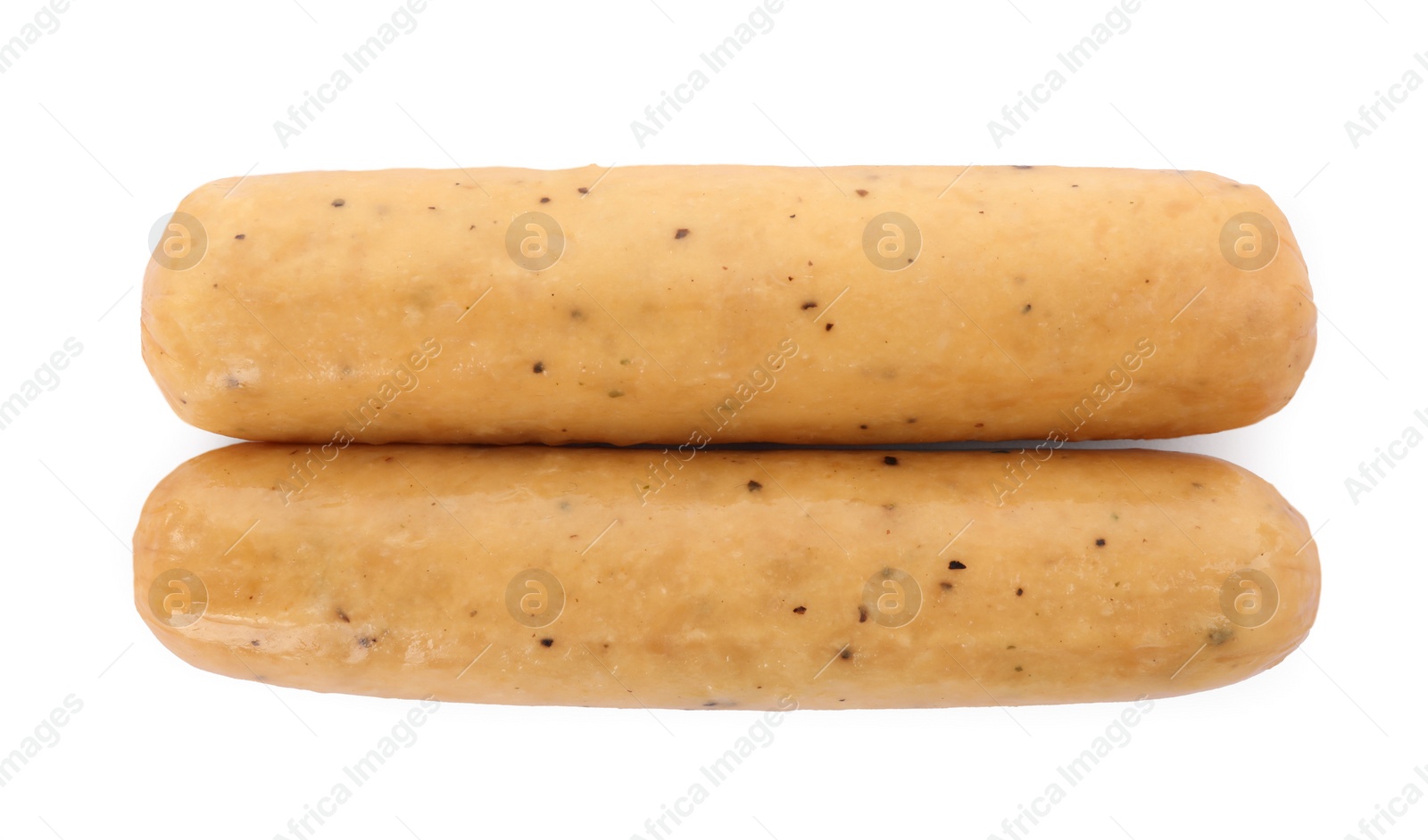 Photo of Raw sausages isolated on white, top view. Vegan meat product