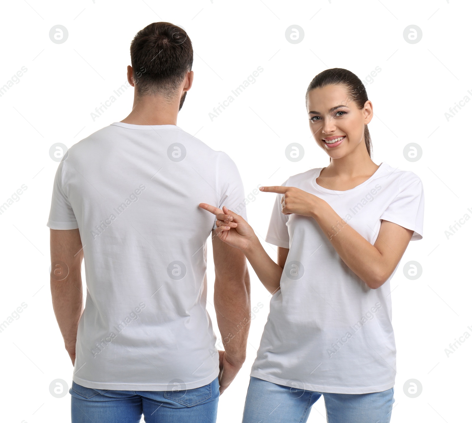 Photo of Young couple in t-shirts on white background. Mockup for design