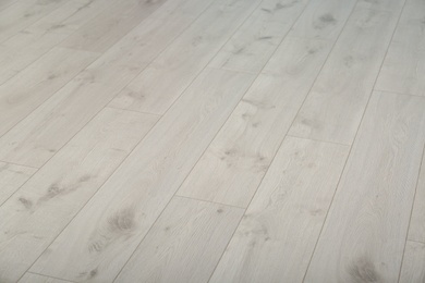 Photo of Light wooden laminate as background. Floor covering