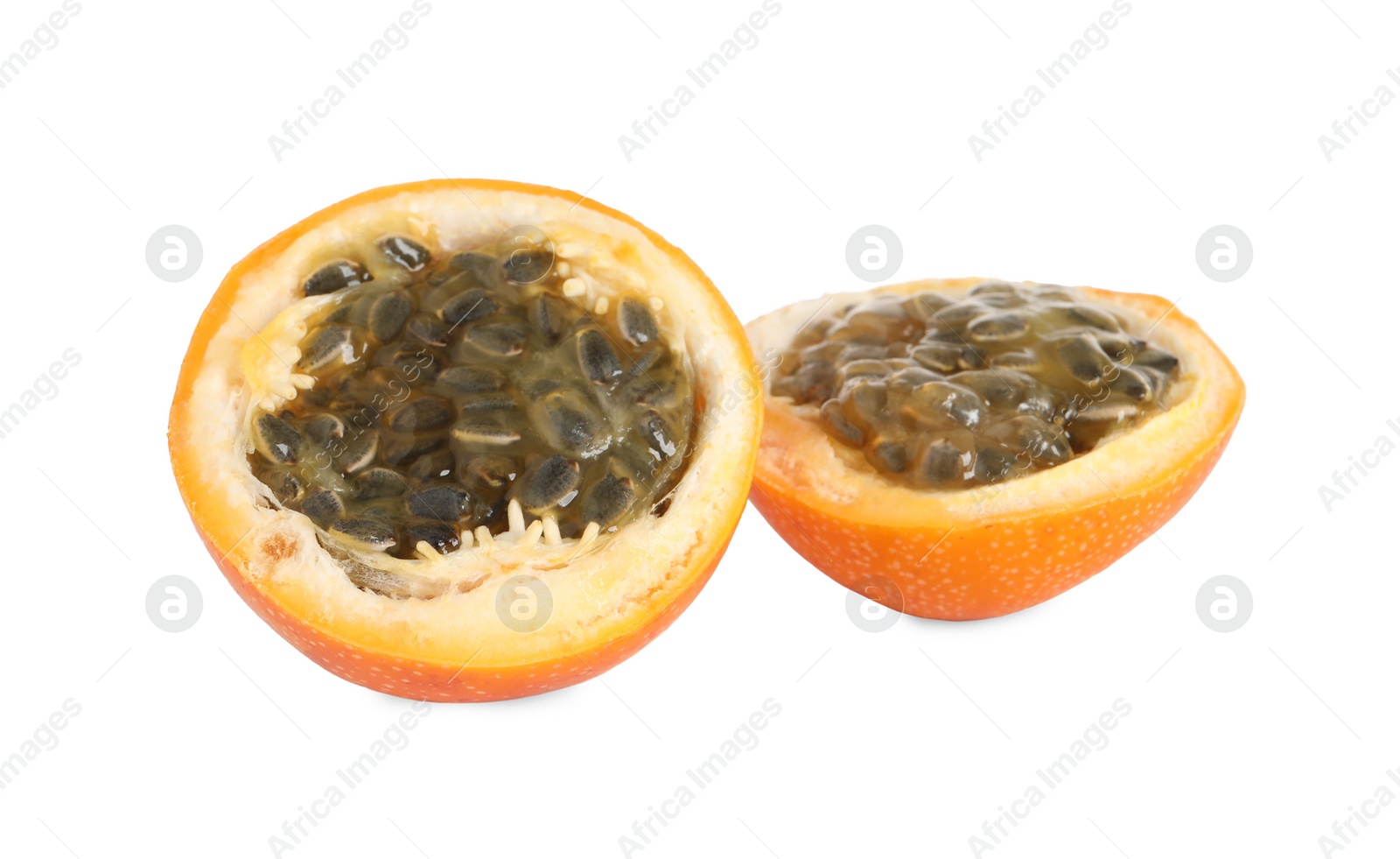 Photo of Halves of delicious ripe granadilla isolated on white