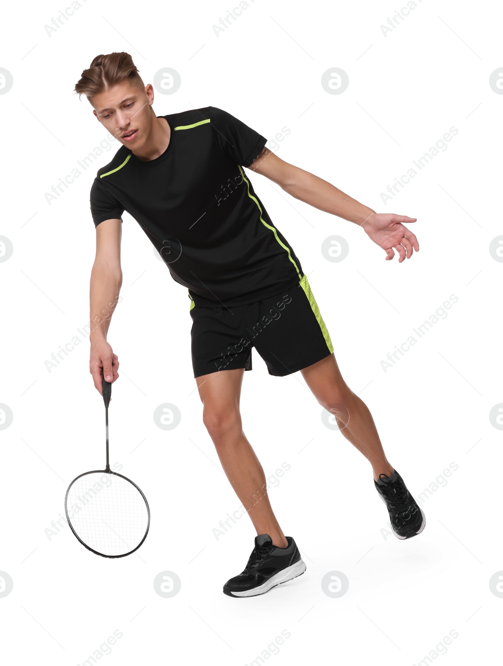 Photo of Young man playing badminton with racket on white background