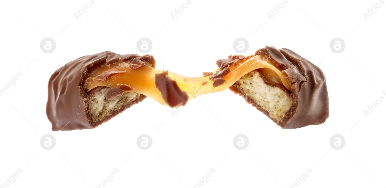 Photo of Pieces of chocolate bar with caramel on white background