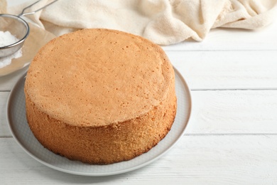 Photo of Delicious fresh homemade cake on white wooden table